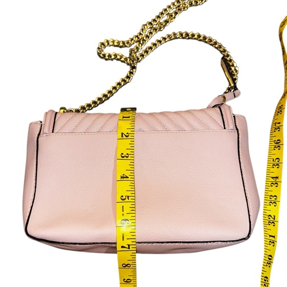 Victoria Secret purse has thick gold chain shoulder strap, magnetic snap pinkish